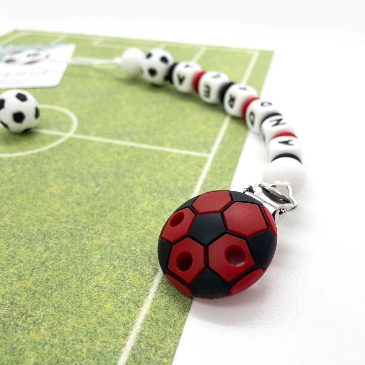 catenina portaciuccio calcio neonato pallone tifoso squadra rosso nera in silicone alimentare senza BPA certificato
