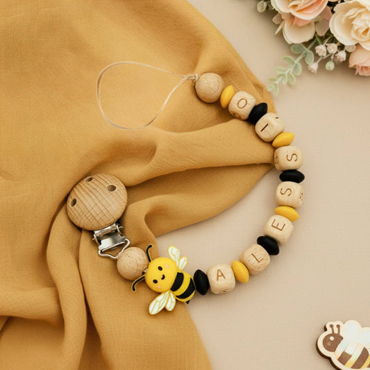 Catenella ciuccio Ape personalizzabile con nome Alessio, clip in legno naturale e perline gialle e nere, sicura per neonati.